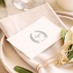 Baptism stamp with a wreath of leaves