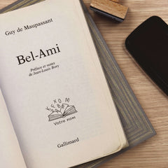 Ex Libris stamp, book with floating letters