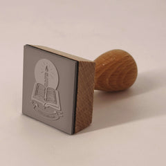 Ex-libris stamp, book and candle