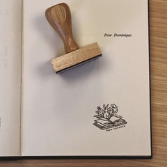 Ex-libris stamp depicting vegetation emerging from the book
