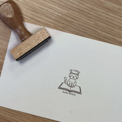 Ex-libris stamp with cat on book