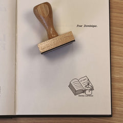 Ex-libris stamp in front of book